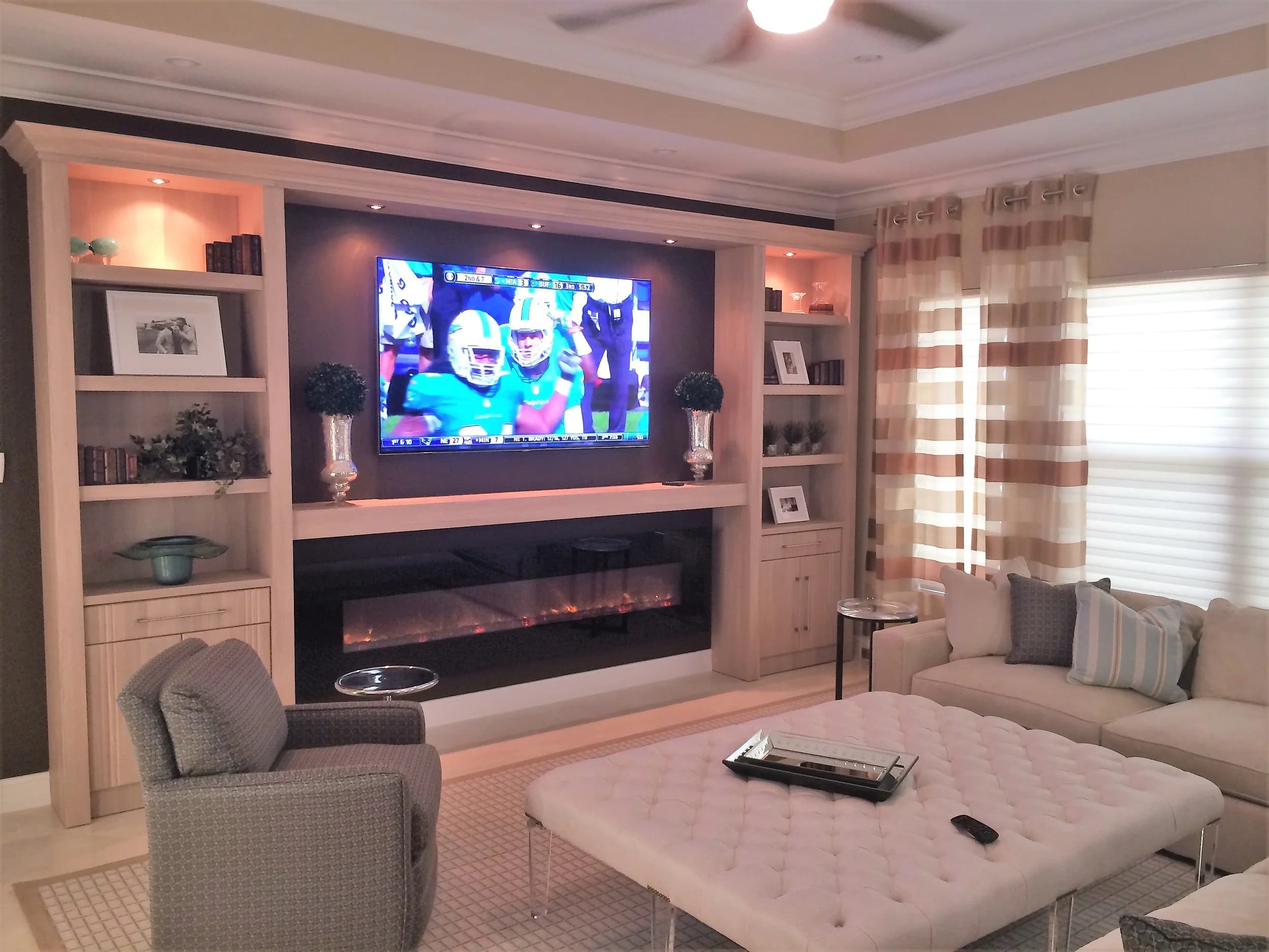 Built-in entertainment wall with a linear fireplace beneath the display