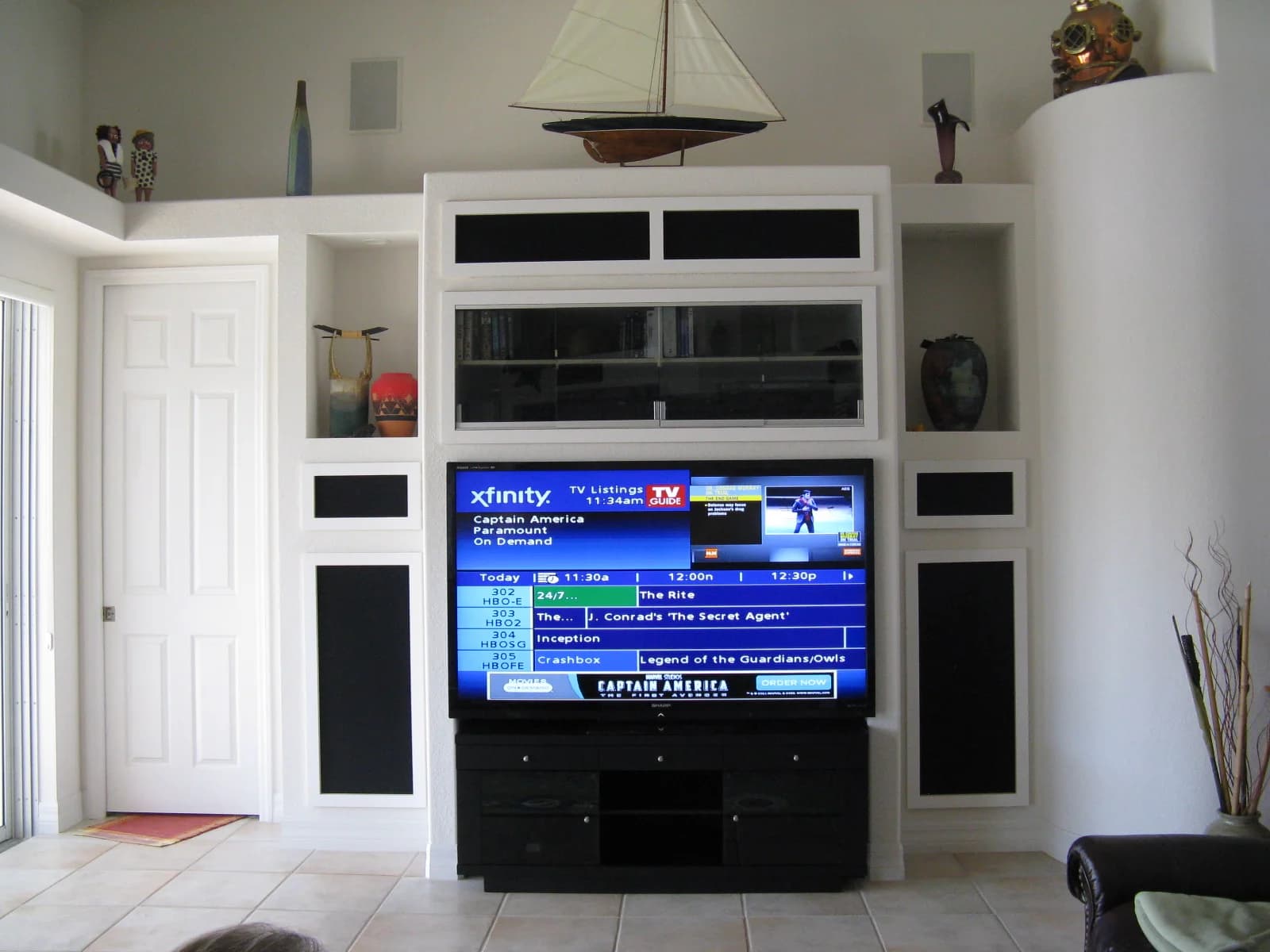 AV equipment stack built into a cabinetry niche