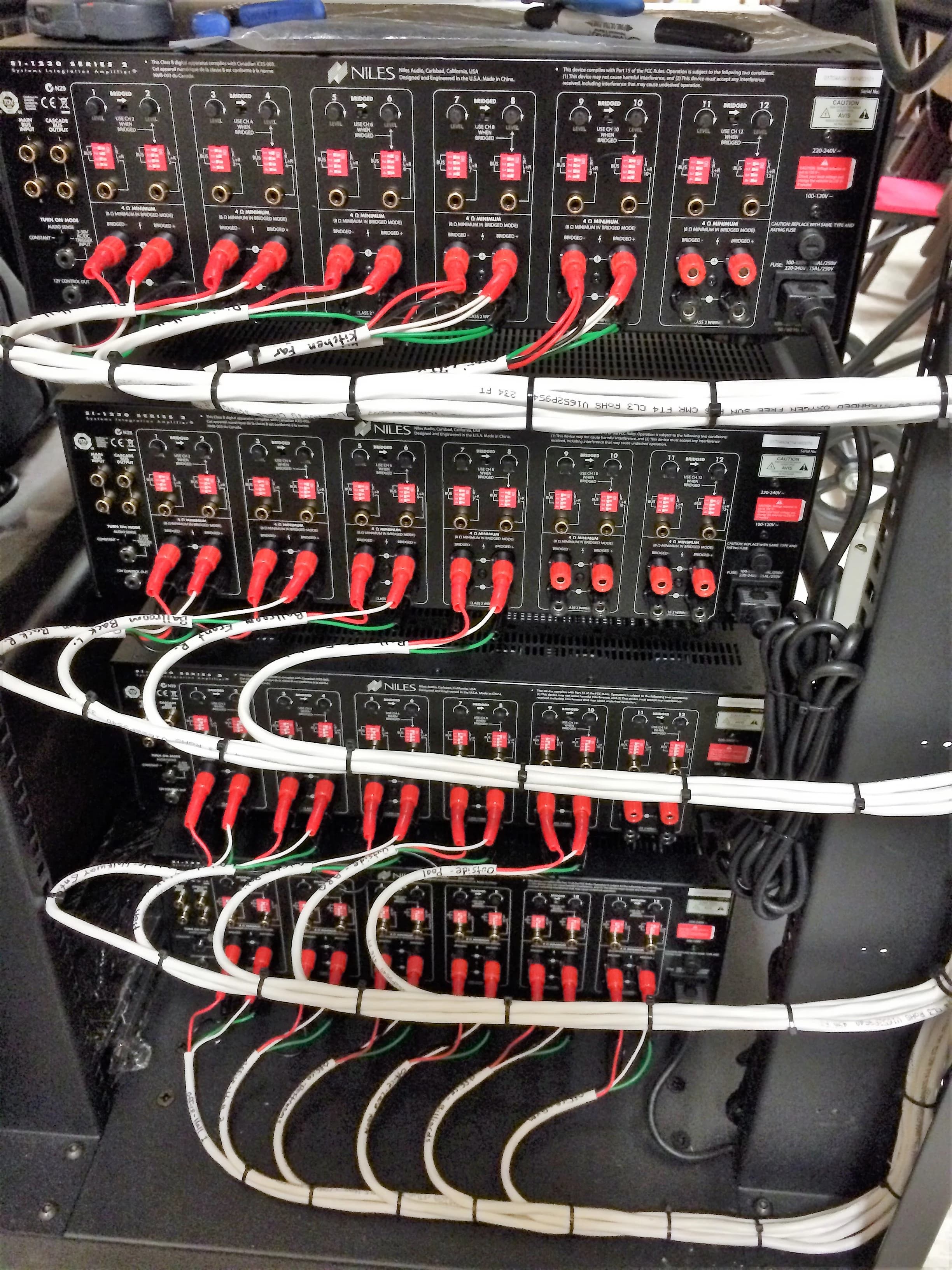 Rear of a Maxtech Audio rack with every speaker run dressed, bundled and labelled